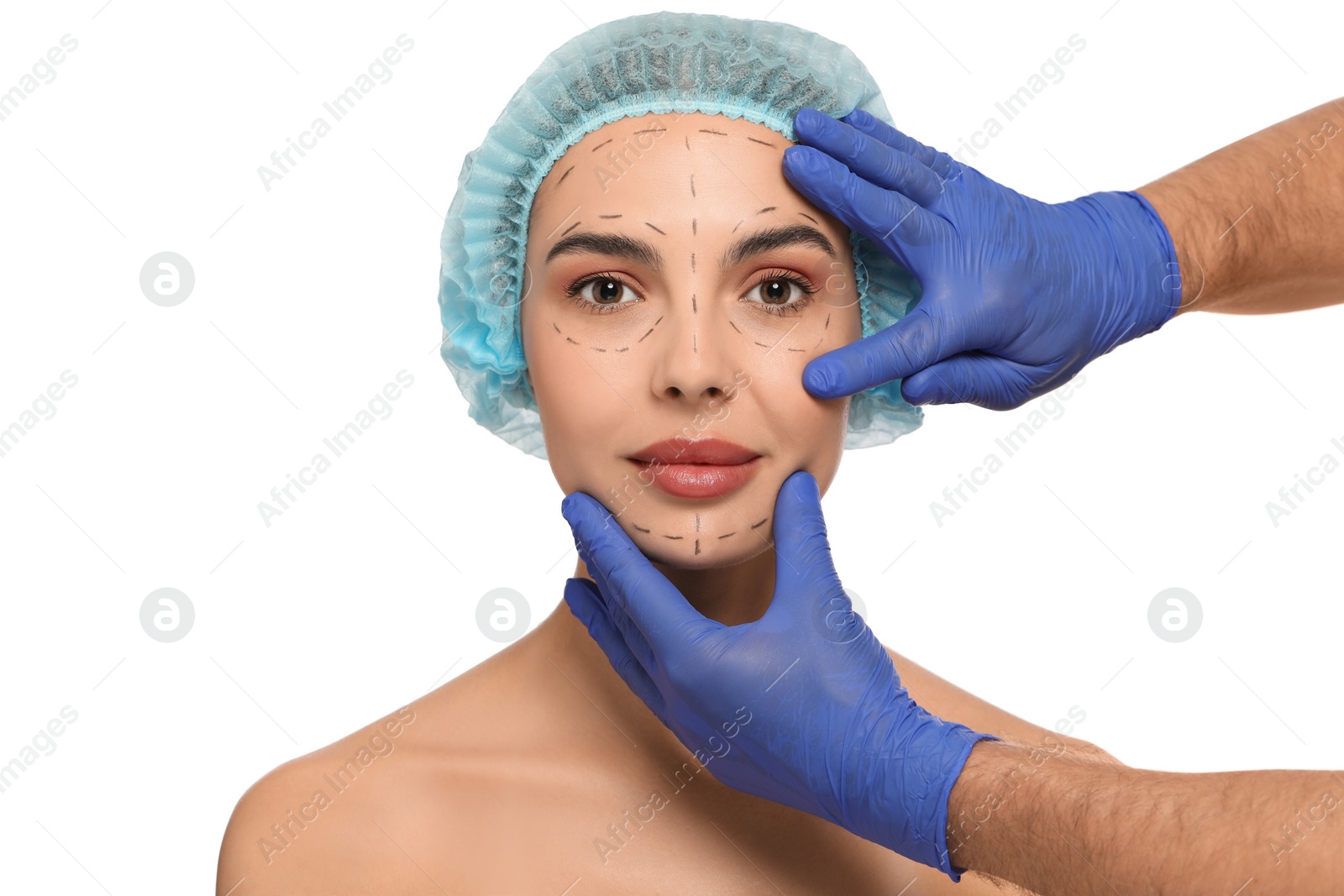 Photo of Doctor checking patient's face before cosmetic surgery operation on white background