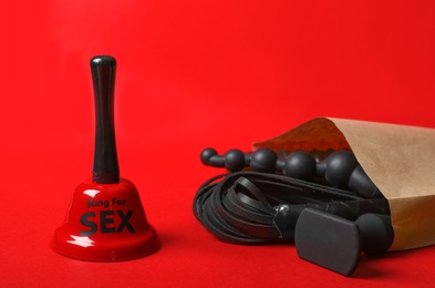 Photo of Set of different sex toys on red background