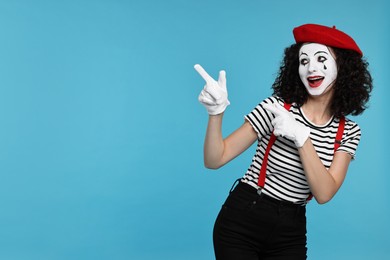 Funny mine with beret posing on light blue background, space for text