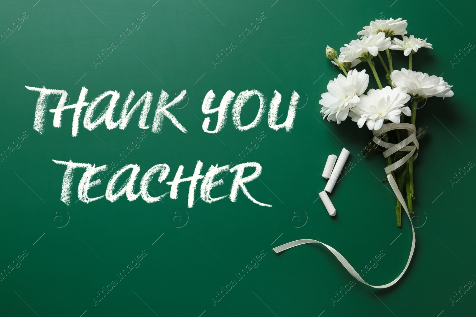 Image of Phrase Thank You Teacher, beautiful flowers and chalk on green chalkboard, flat lay