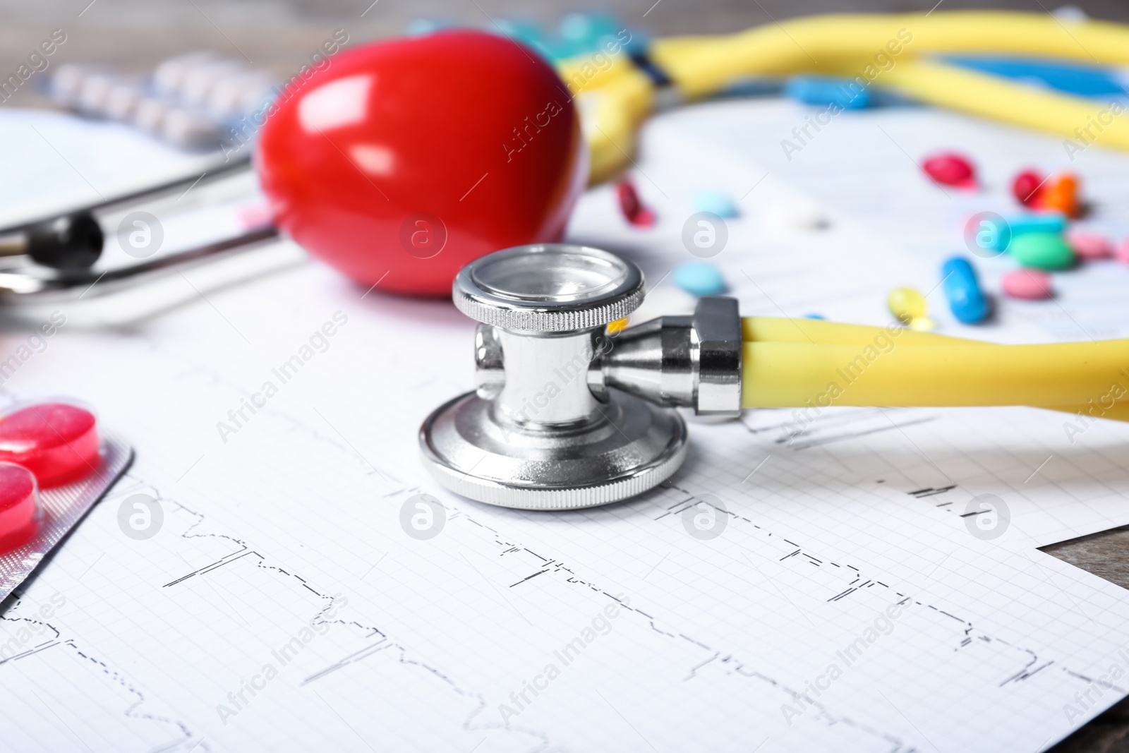 Photo of Stethoscope and cardiogram on table. Cardiology service