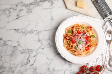 Photo of Flat lay composition with tasty pasta on white marble table, space for text