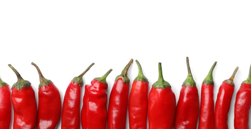 Photo of Fresh red chili peppers on white background, top view with space for text