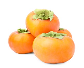 Whole delicious juicy persimmons on white background