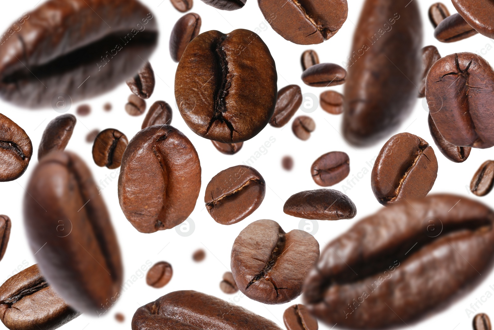 Image of Roasted coffee beans falling o white background