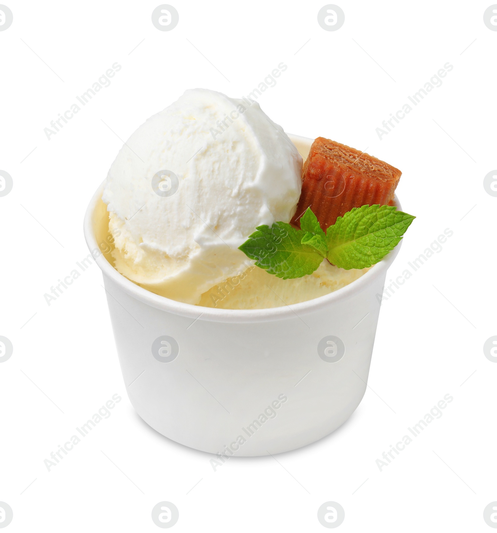 Photo of Tasty ice cream with caramel candy and mint leaves in paper cup isolated on white