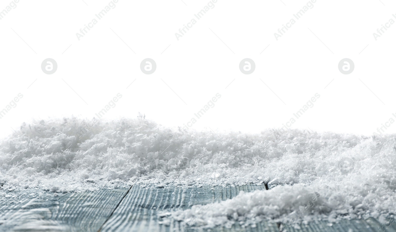 Photo of Wooden surface covered with snow against white background