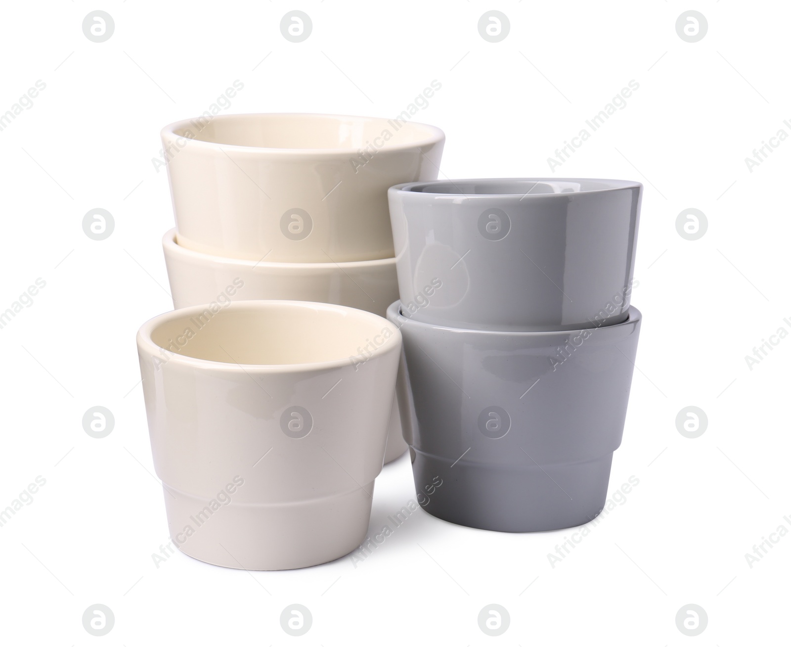 Photo of Different empty ceramic flower pots on white background