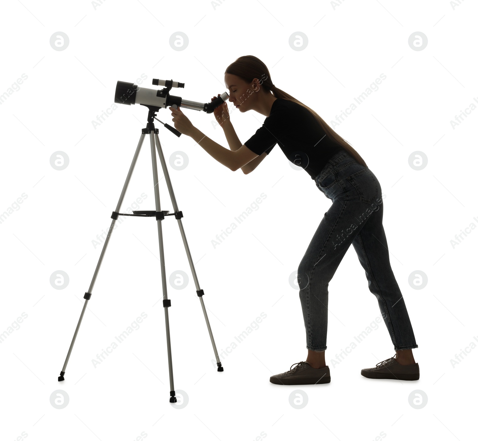 Photo of Young astronomer looking at stars through telescope on white background