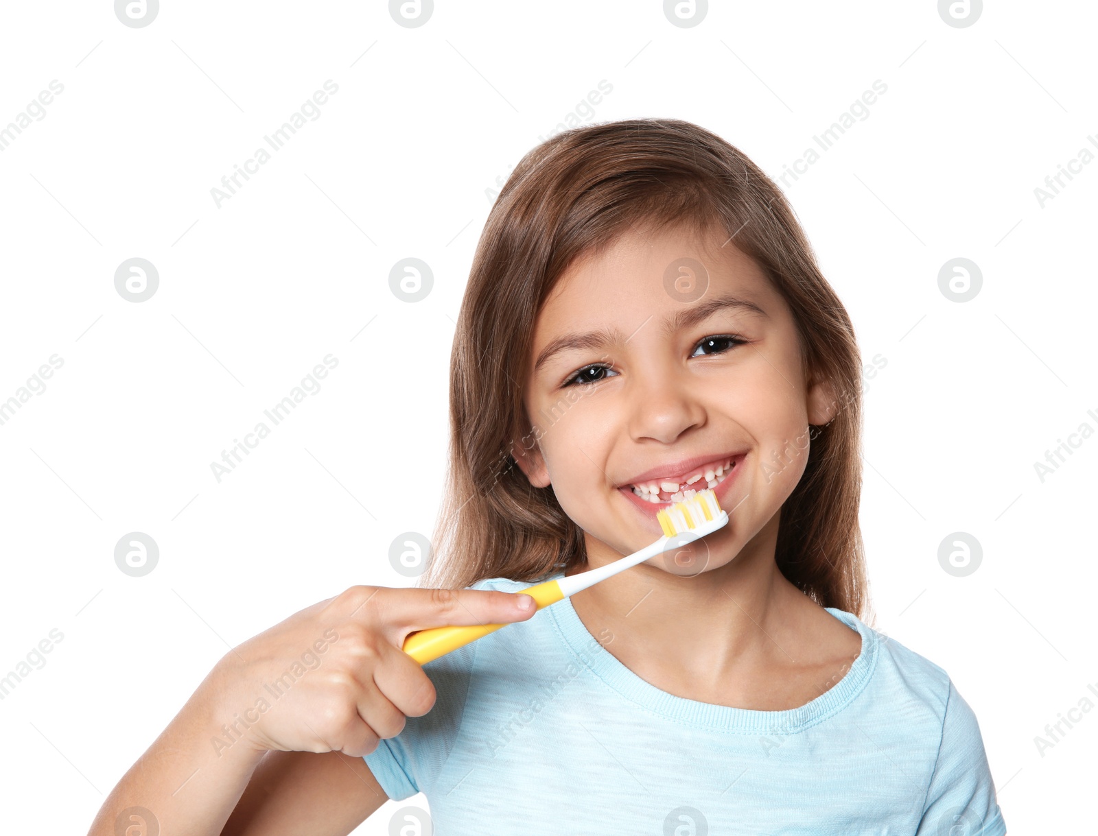 Photo of Portrait of little girl with toothbrush on white background