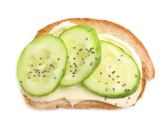 Slice of bread with spread and cucumber on white background, top view