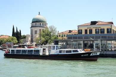 VENICE, ITALY - JUNE 13, 2019: Modern boat moored at pier