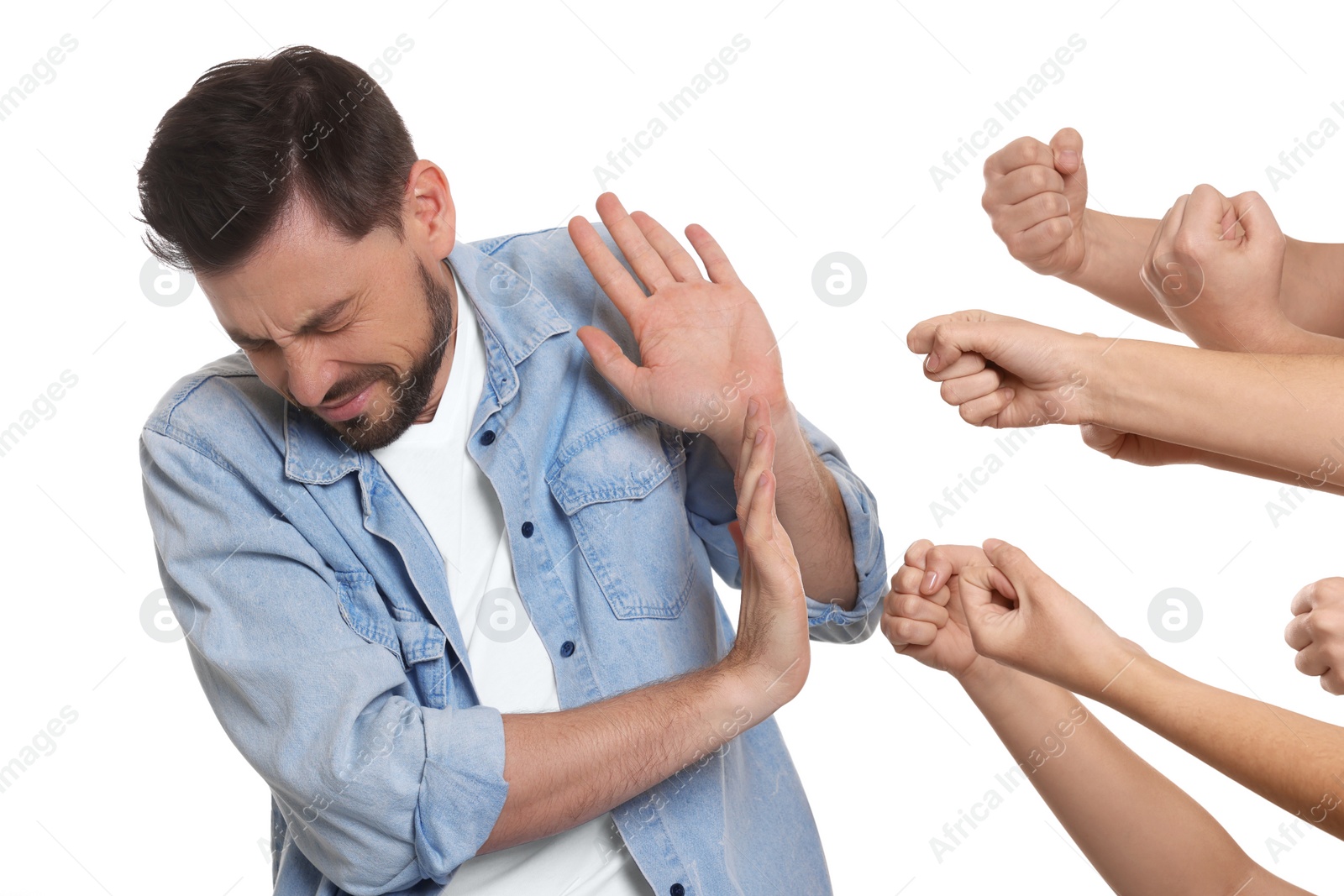 Photo of People bullying scared man on white background