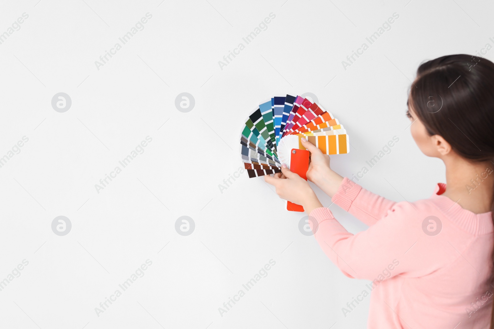 Photo of Young woman with color palette on white background