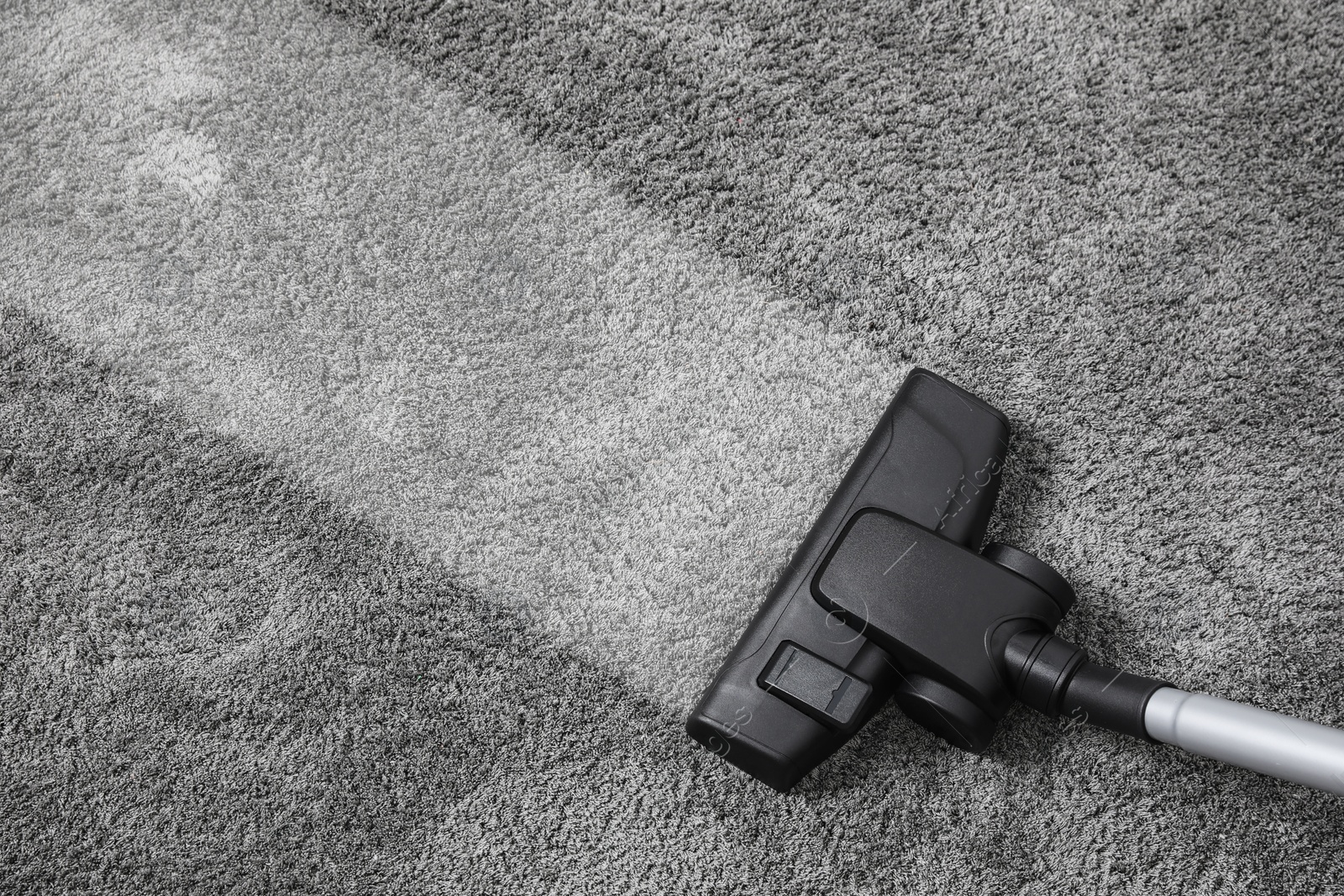 Image of Vacuuming carpet. Clean area after using device, top view