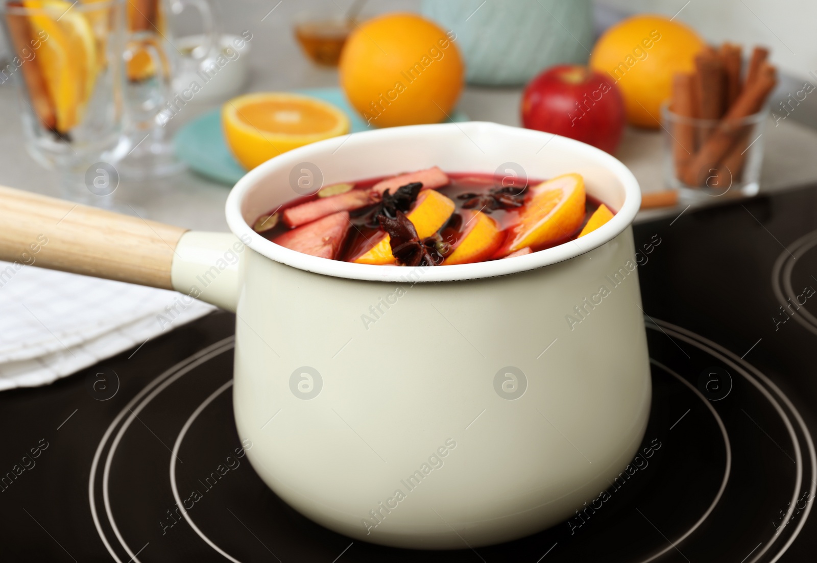 Photo of Delicious hot mulled wine in pot on stove