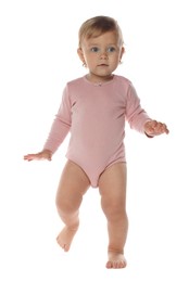 Photo of Cute baby girl in pink bodysuit learning to walk on white background