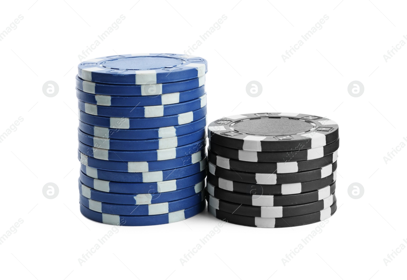 Photo of Plastic casino chips stacked on white background. Poker game