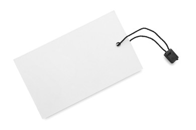 Photo of Blank tag on white background, top view. Space for text