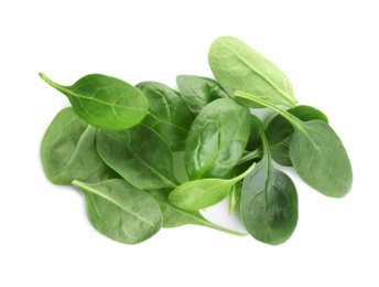 Pile of fresh green healthy baby spinach leaves on white background, top view