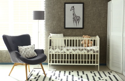 Cozy baby room interior with comfortable crib