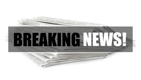 Image of Phrase Breaking News and stack of newspapers on white background. Journalist's work