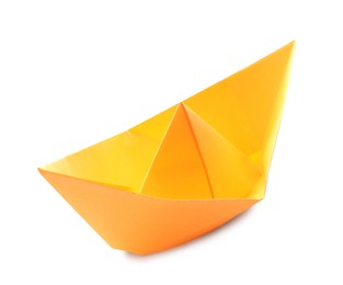 Photo of Handmade orange paper boat isolated on white. Origami art