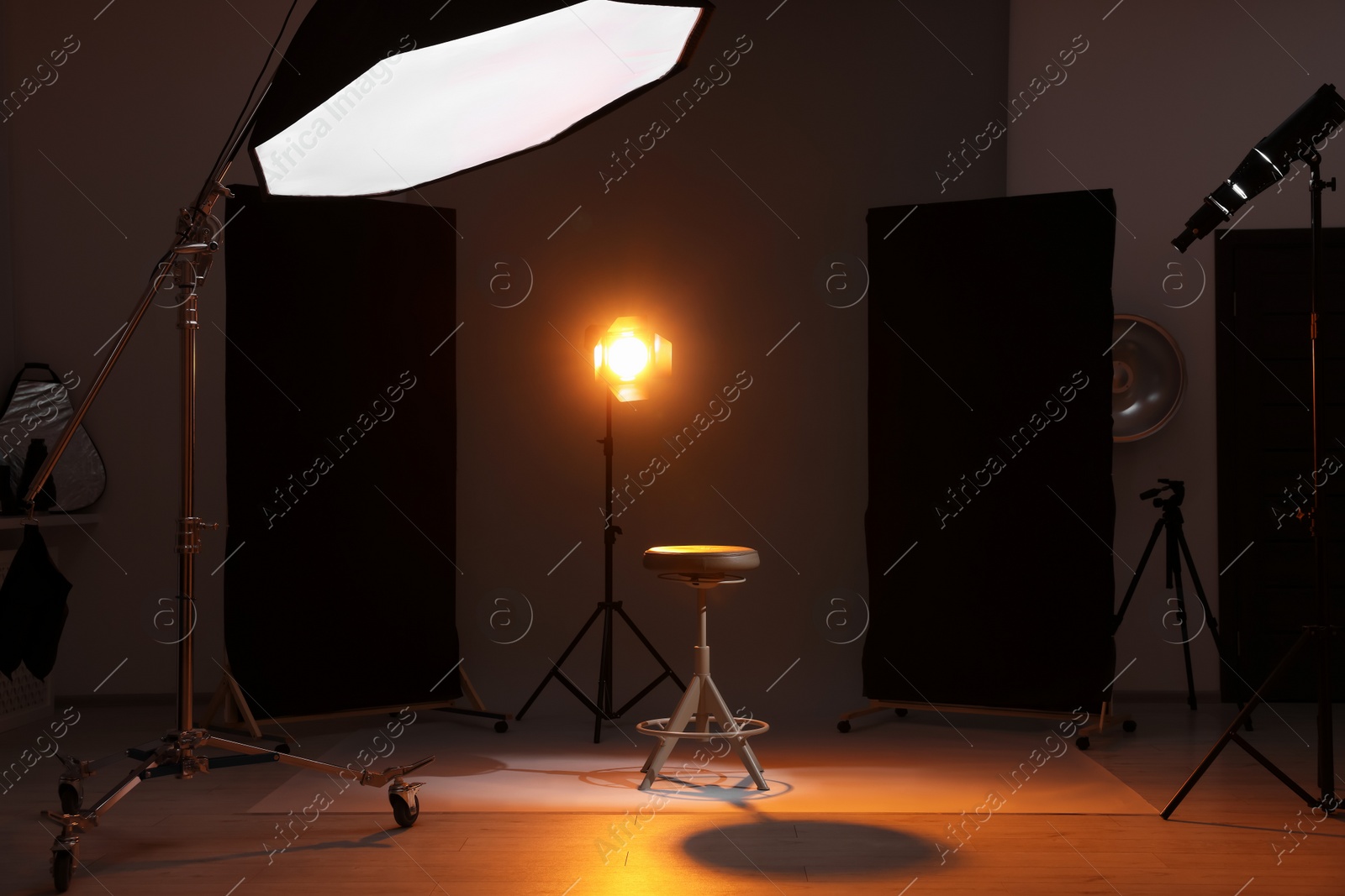 Photo of Casting call. Chair and different equipment in modern studio