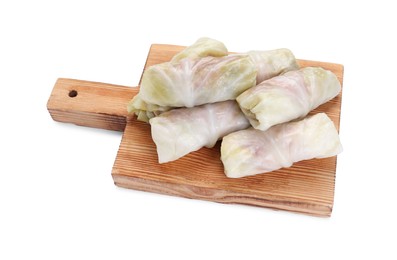 Photo of Wooden board with Uncooked stuffed cabbage rolls isolated on white