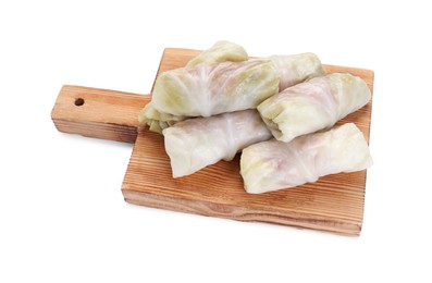 Wooden board with Uncooked stuffed cabbage rolls isolated on white