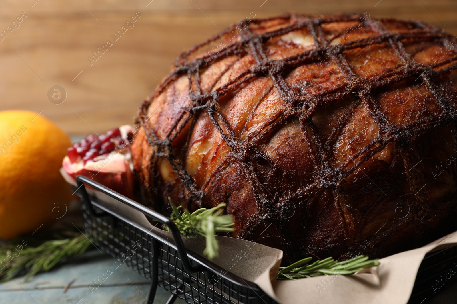 Photo of Delicious baked ham and rosemary on table, closeup