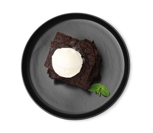 Photo of Tasty brownies with ice cream and mint isolated on white, top view