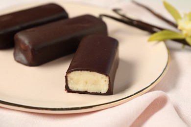 Glazed vanilla curd cheese bars served on table, closeup