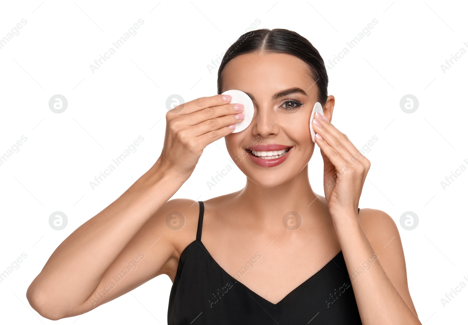 Photo of Beautiful woman removing makeup with cotton pads on white background