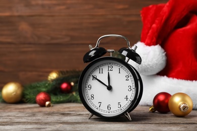 Retro alarm clock and decor on table. Christmas countdown