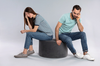 Photo of Couple with relationship problems on light grey background