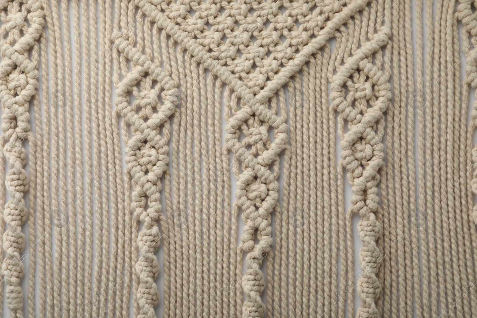 Photo of Texture of beautiful macrame as background, top view. Decorative element