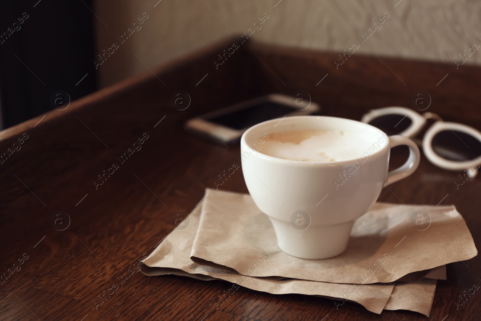 Photo of Cup of fresh aromatic coffee on table