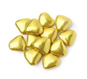 Pile of heart shaped candies on white background, top view