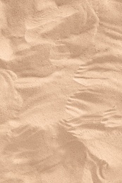 Photo of Golden beach sand on sunny day as background