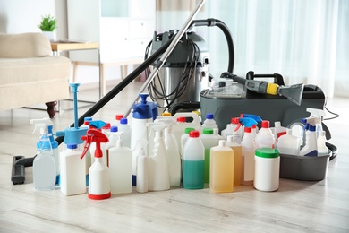 Photo of Professional cleaning supplies and equipment on floor indoors