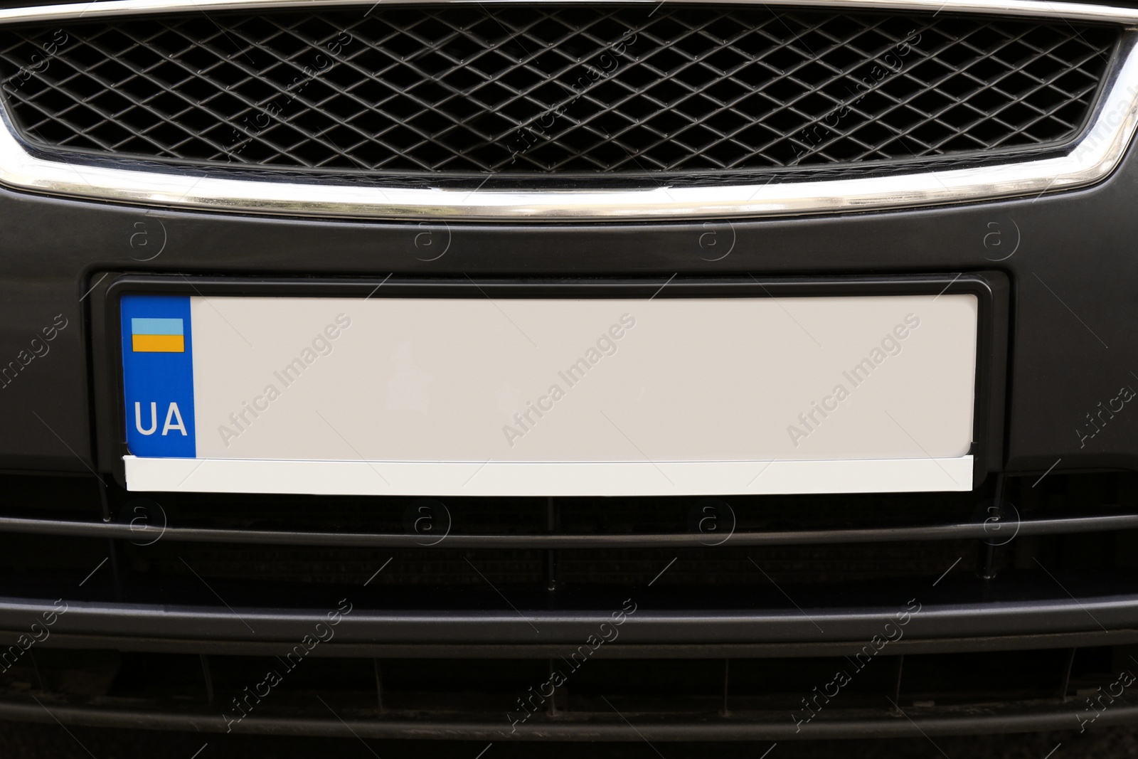 Photo of Car with vehicle registration plate, closeup view