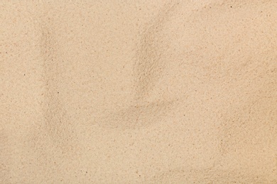 Photo of Dry beach sand as background, top view