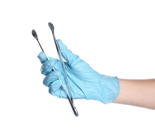 Photo of Doctor in sterile glove holding medical forceps on white background