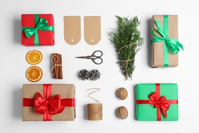 Composition with Christmas gifts on white background, top view