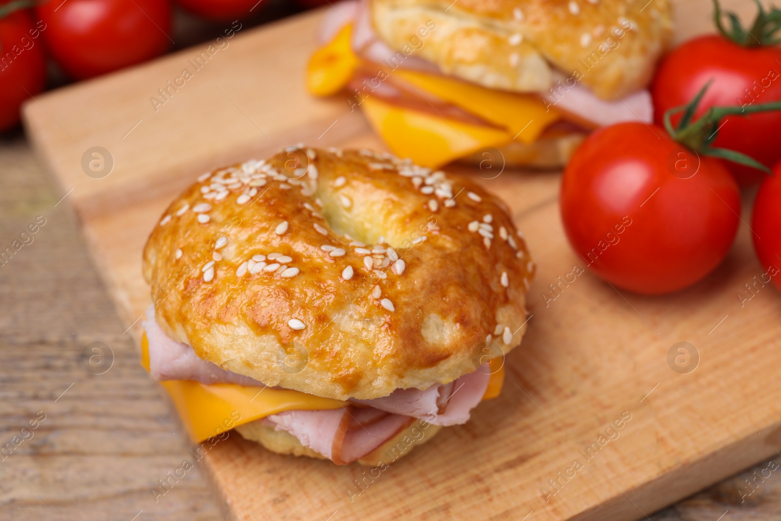 Delicious bagels with ham and cheese on table, closeup Photo of Delicious bagels with ham and cheese on table, closeup