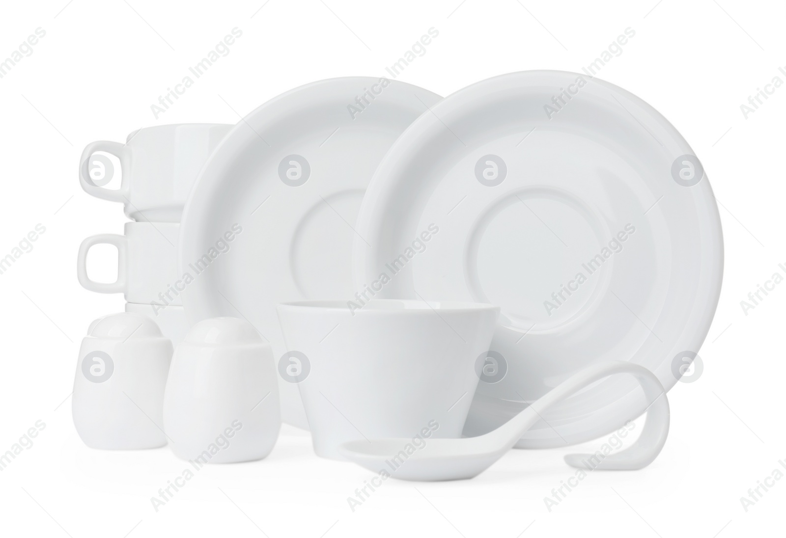 Photo of Set of clean dishware isolated on white