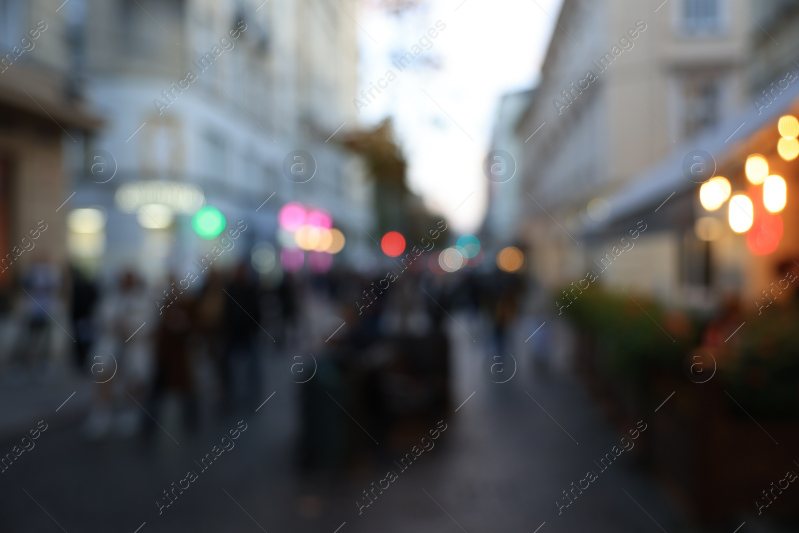 Photo of Blurred view of people walking on city street