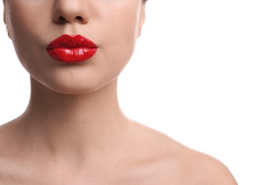 Closeup view of beautiful woman puckering lips for kiss on white background