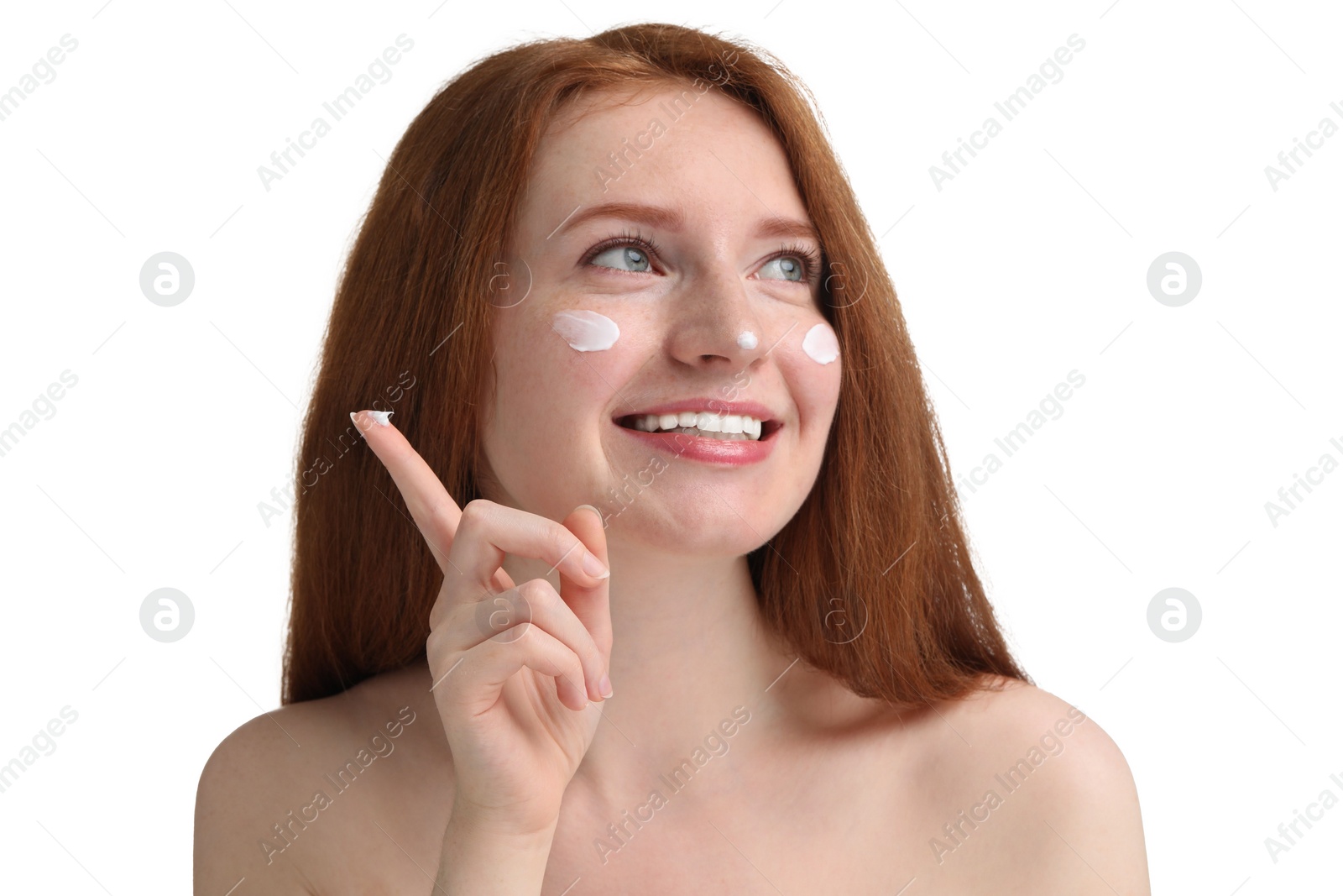 Photo of Smiling woman with freckles and cream on her face against white background, closeup